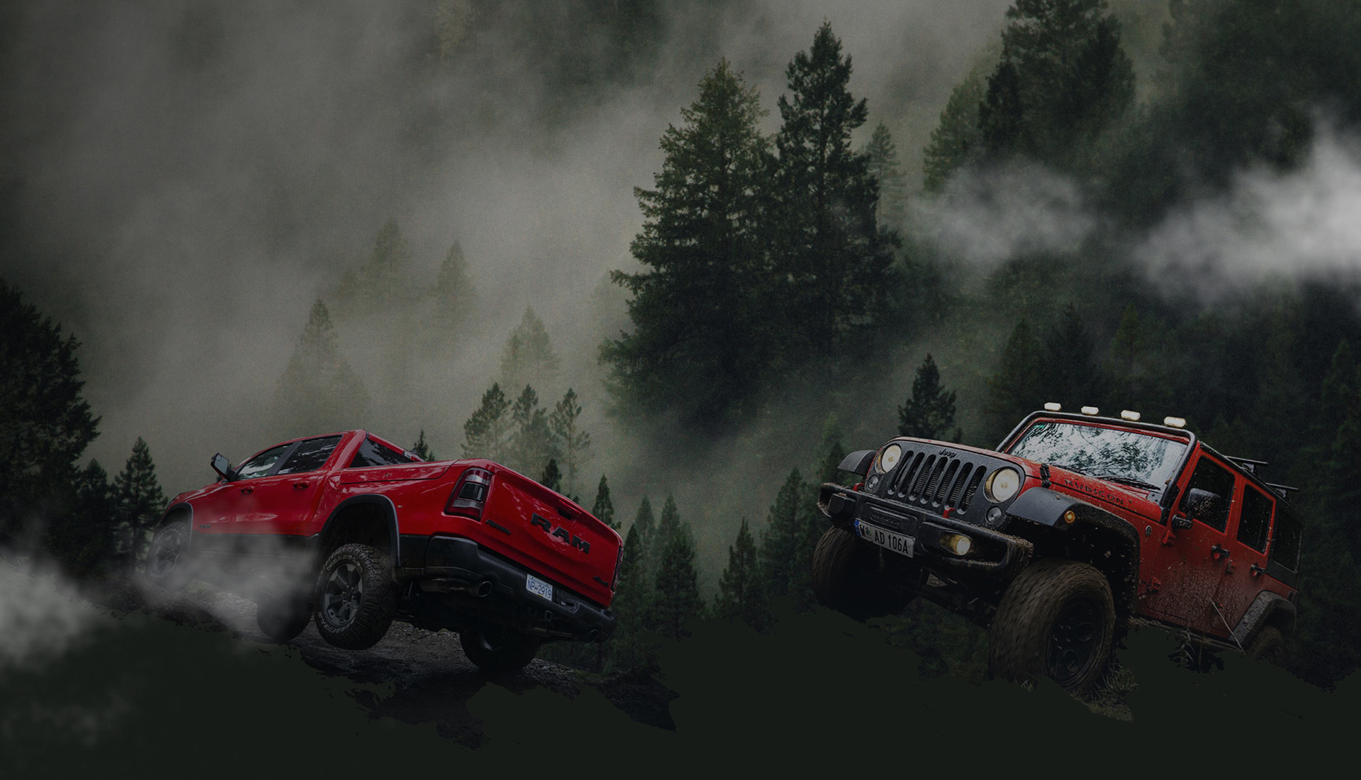 two offroad cars driving through the forest in the mist