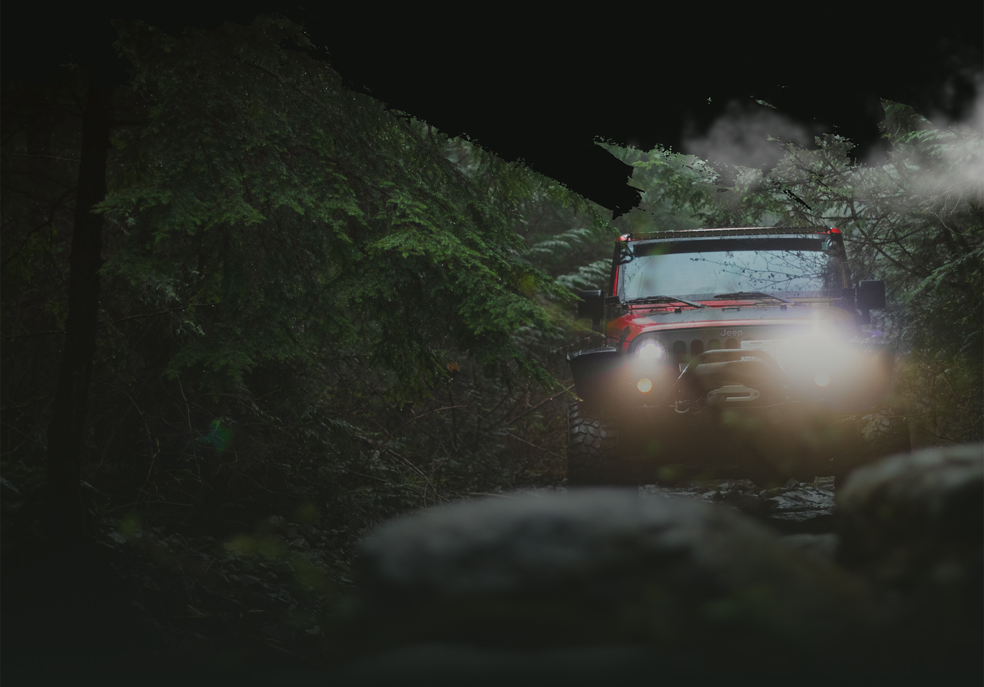 offroad jeep driving towards you in the forest